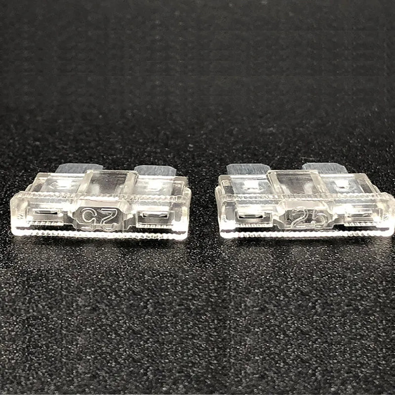 Box containing medium-sized plug-in fuses for automotive low voltage circuits