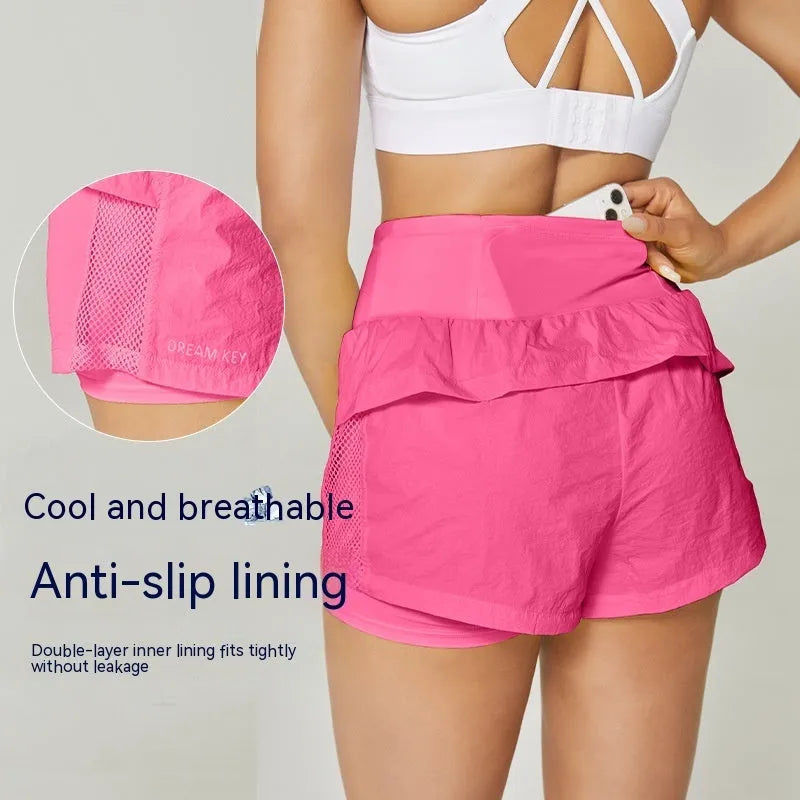 Women's loose casual quick-drying sports shorts in a cotton blend fabric on a hanger.