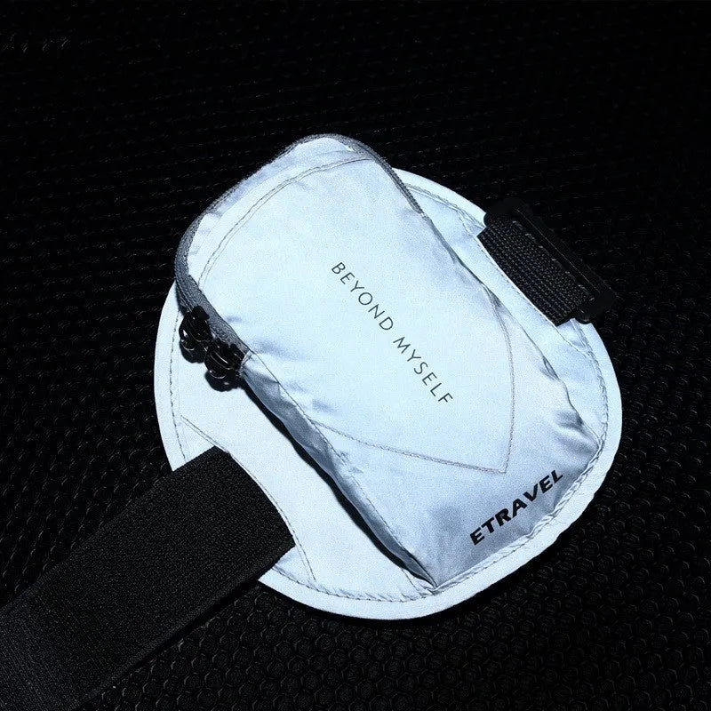 Running arm bag worn on arm with reflective strip, showing smartphone compartment and adjustable strap