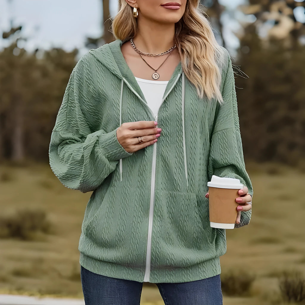 Green women's hooded zip-front sweater coat with loose fit and long sleeves.