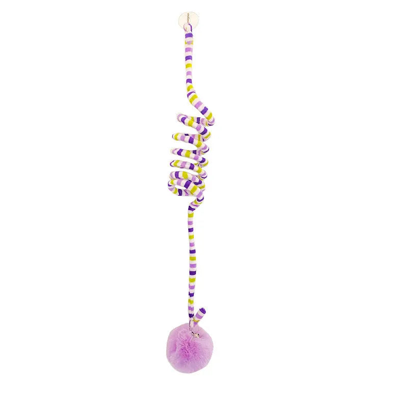 Spring cat toy with bell stick and inflatable ball hanging from door with suction cup