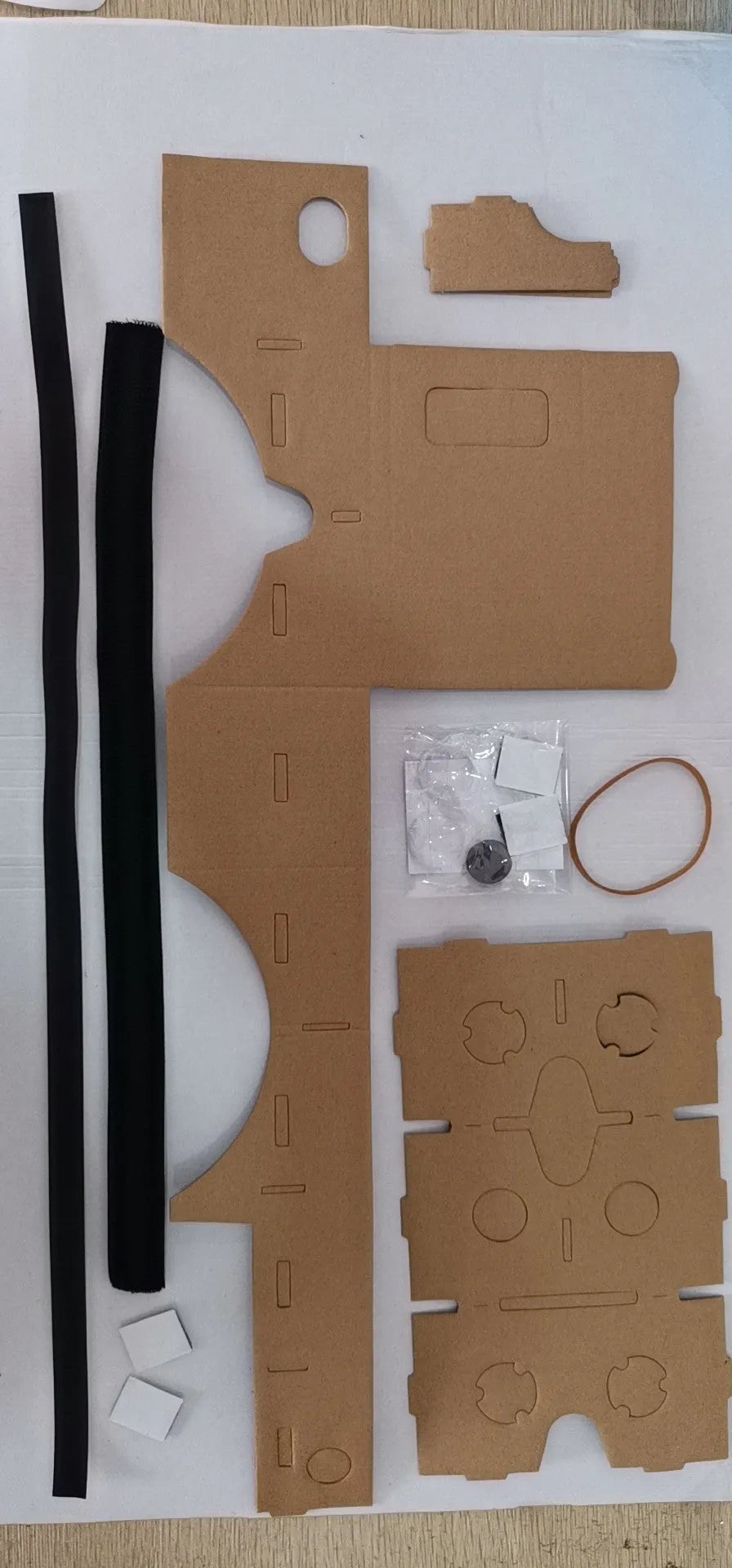 Pink and white cardboard VR glasses for smartphones with adjustable rubber band head strap