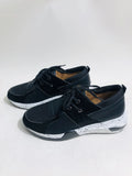 Women's black suede casual sneakers with a wedge heel and round toe on a white background.