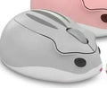 Yellow Bluetooth wireless mouse next to hamster habitat showing compact 105mm size