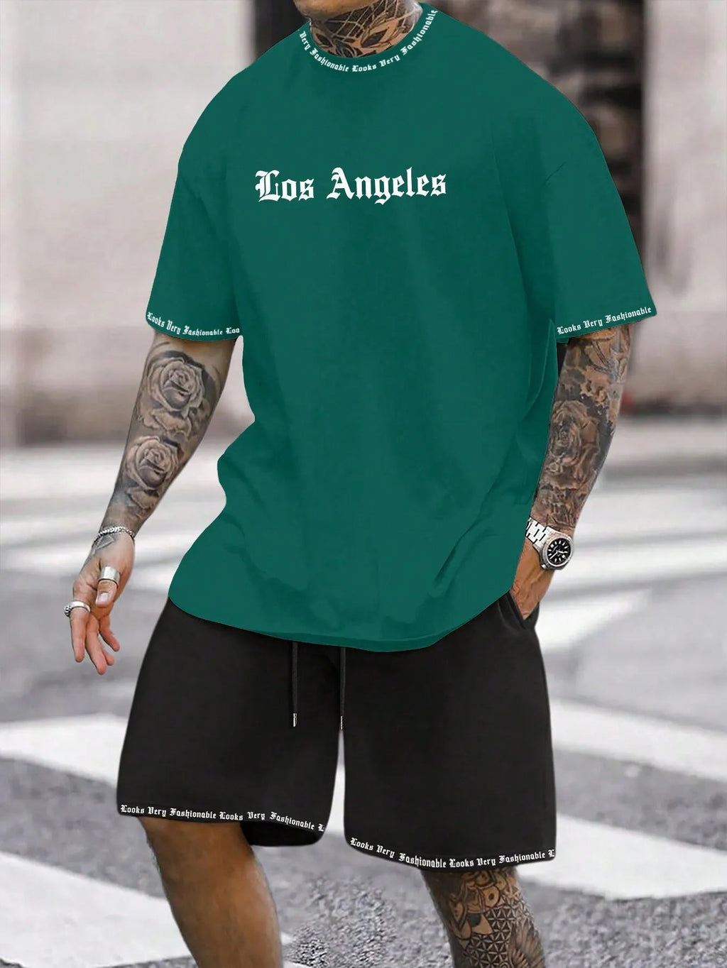 Sports style short-sleeved shirt and matching shorts set in a thin, printed fabric on a mannequin.