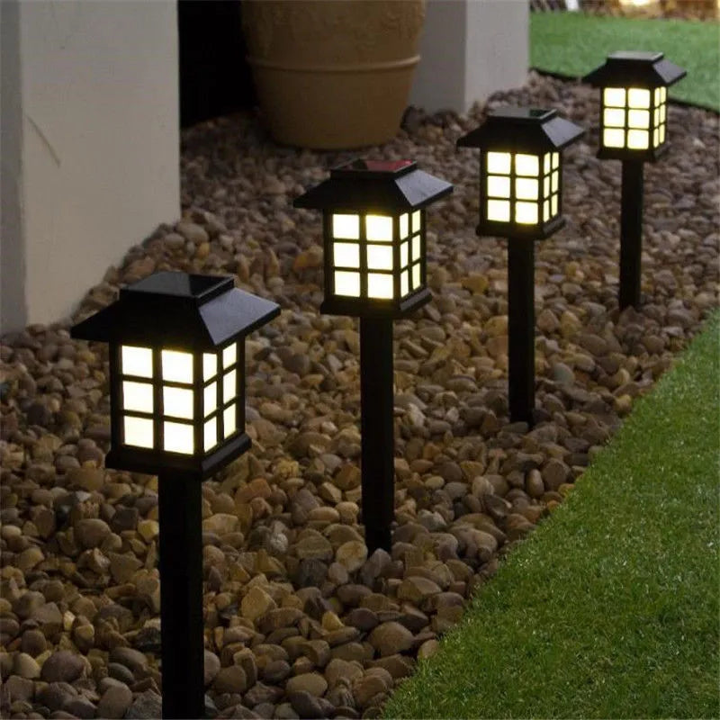 Solar square lawn light with LED, IP44, in a garden setting showing white light illumination