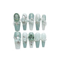 Armour green camellia gradient chain false nails with diamonds, bows and butterflies.