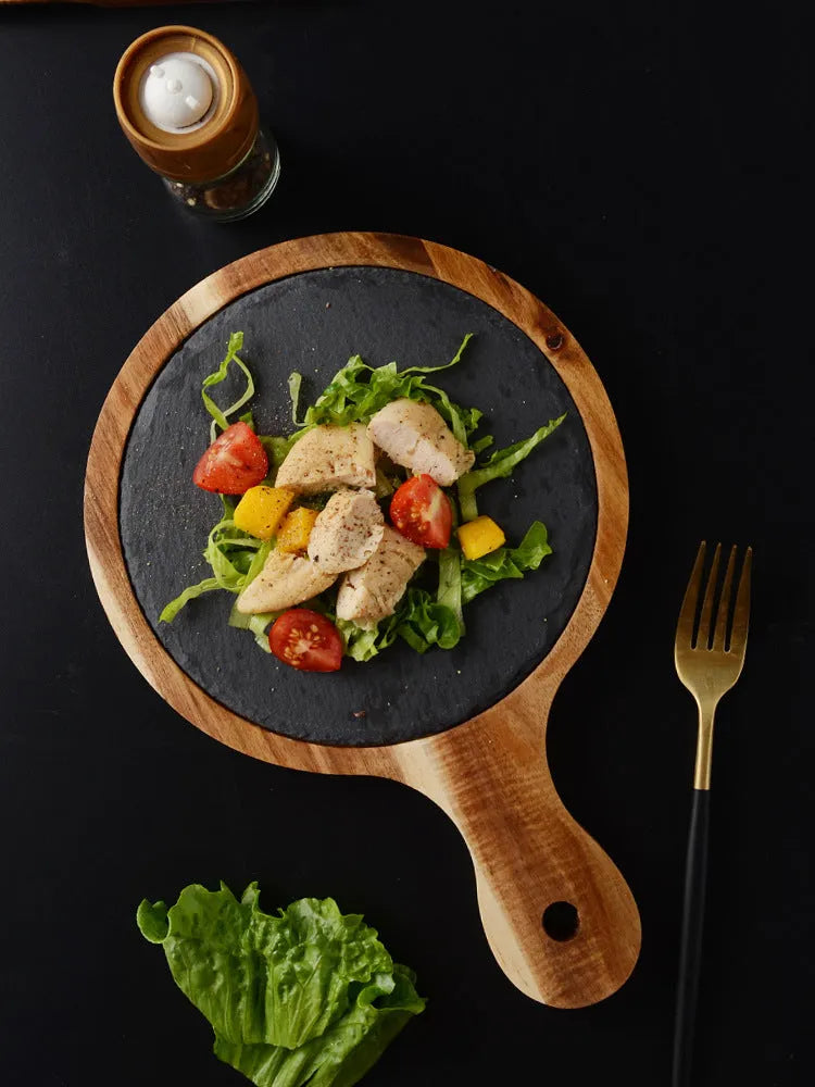 Black wooden pizza dish made from acacia wood and stone, multi-colour sets, on a table