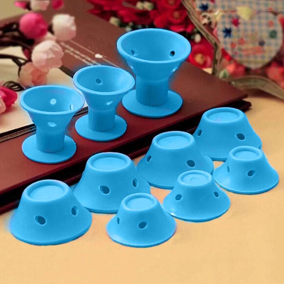 Set of ten soft silicone hair rollers in pink, blue, purple, and black, large 5cm and small 3.9cm diameter