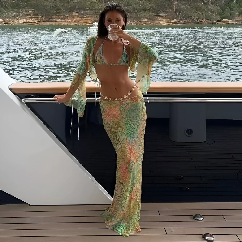 Green halterneck printed lace-up split swimsuit with long bell sleeves on model