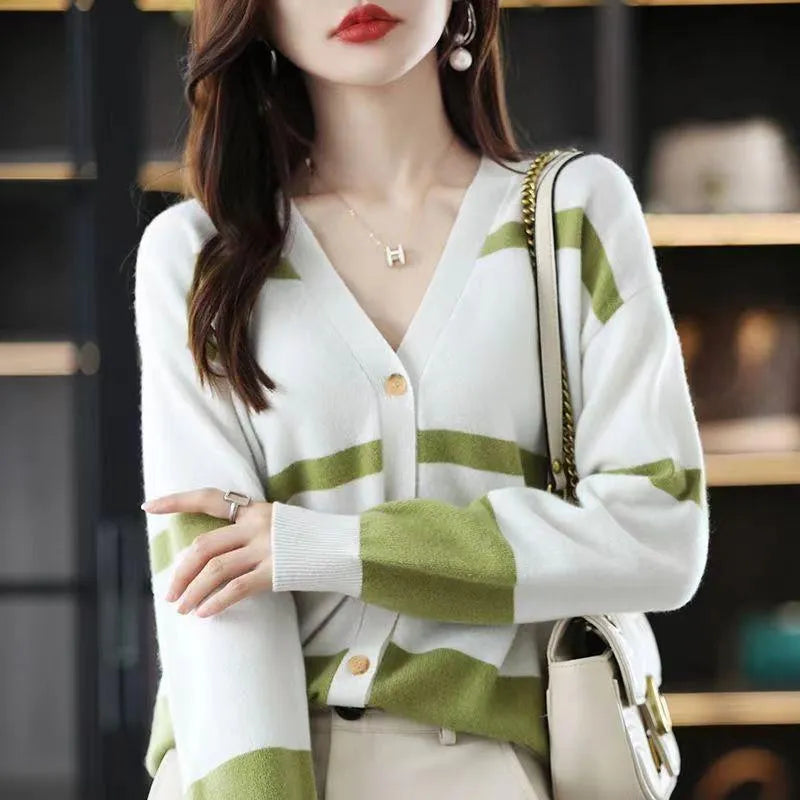 Women's black and white striped V-neck knitted cardigan with 3D pattern and buttons.