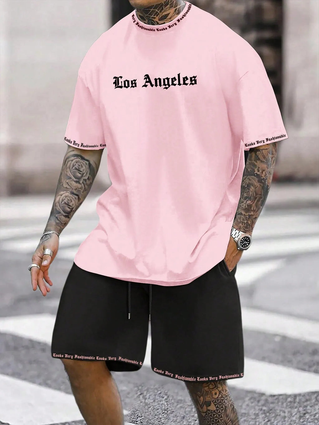 Sports style short-sleeved shirt and matching shorts set in a thin, printed fabric on a mannequin.