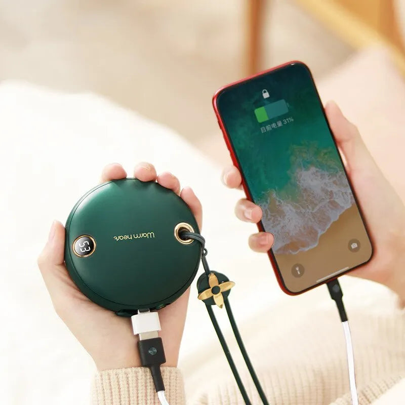 Green 5000mAh power bank with hand warmer function showing digital display, measuring 89.5mm square