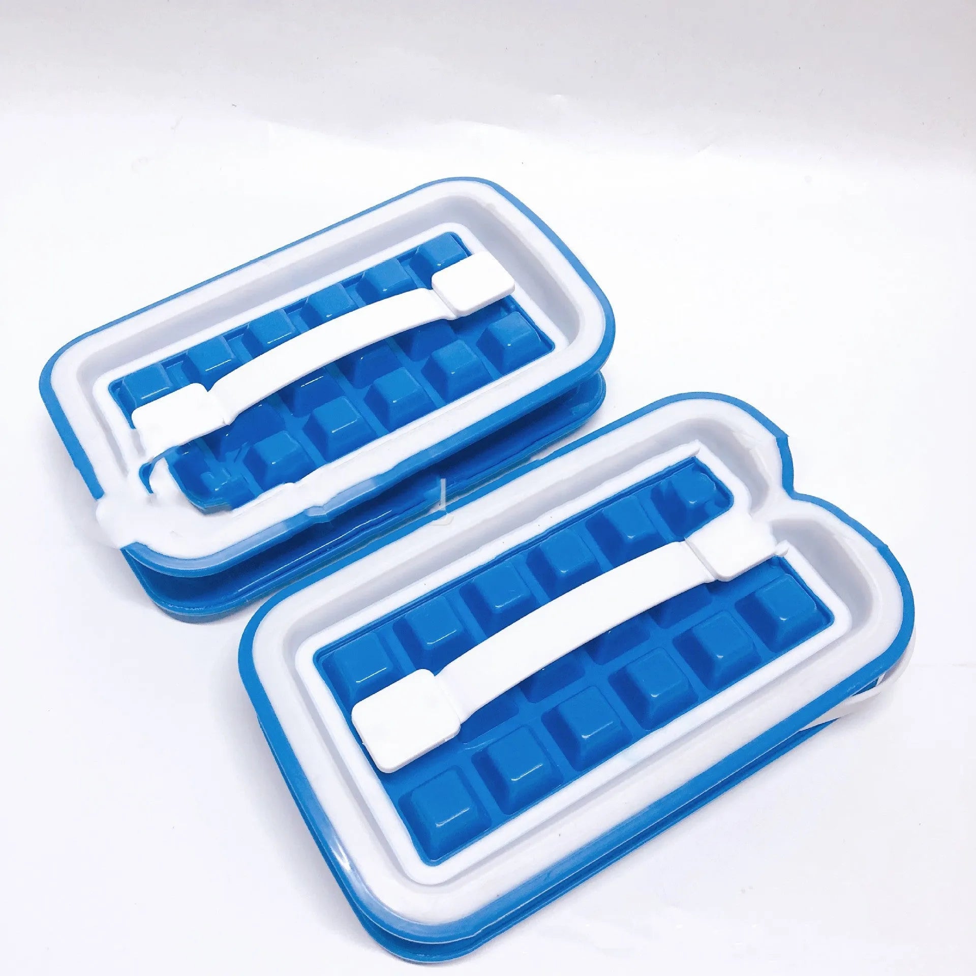 Blue silicone ice cube tray with 36 grid mould and lid on a white surface