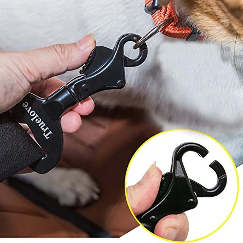 Black aluminium alloy pet car safety buckle with clip on a car seat belt