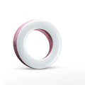 Compact black selfie ring light for mobile phone with USB cable for charging.