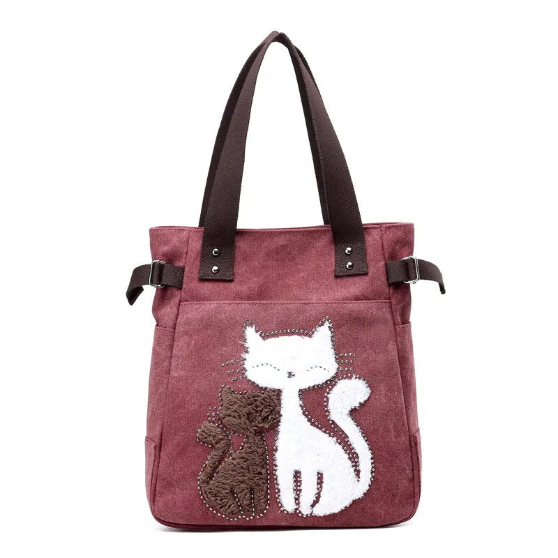 KVKY women canvas shoulder bag with cute plush cat applique in beige colour on white background