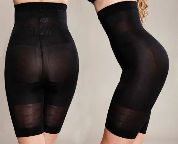 Women's black seamless high waist shapewear shorts laid flat showing tummy control panel and thigh length