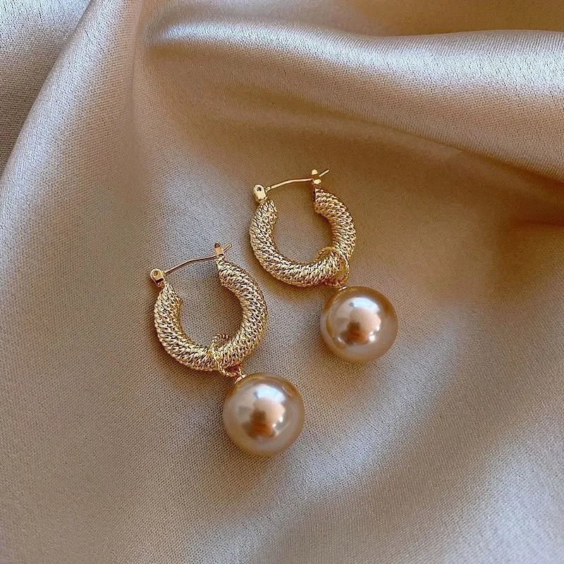 Geometric copper earrings with rose design elements and zircon detail in silver electroplated finish