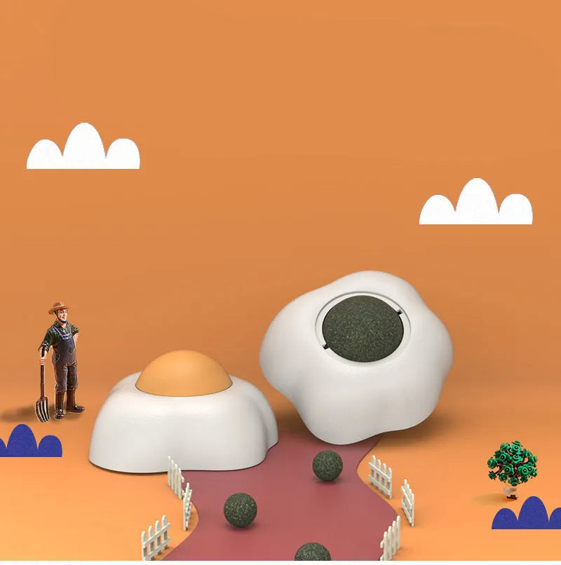 Interactive catnip ball toy stuck to wall with cat playing, showing fried egg and poached egg shape options