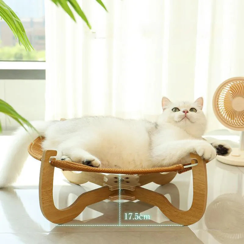 Brown woven rattan pet hammock bed for cats and small dogs on elevated stand