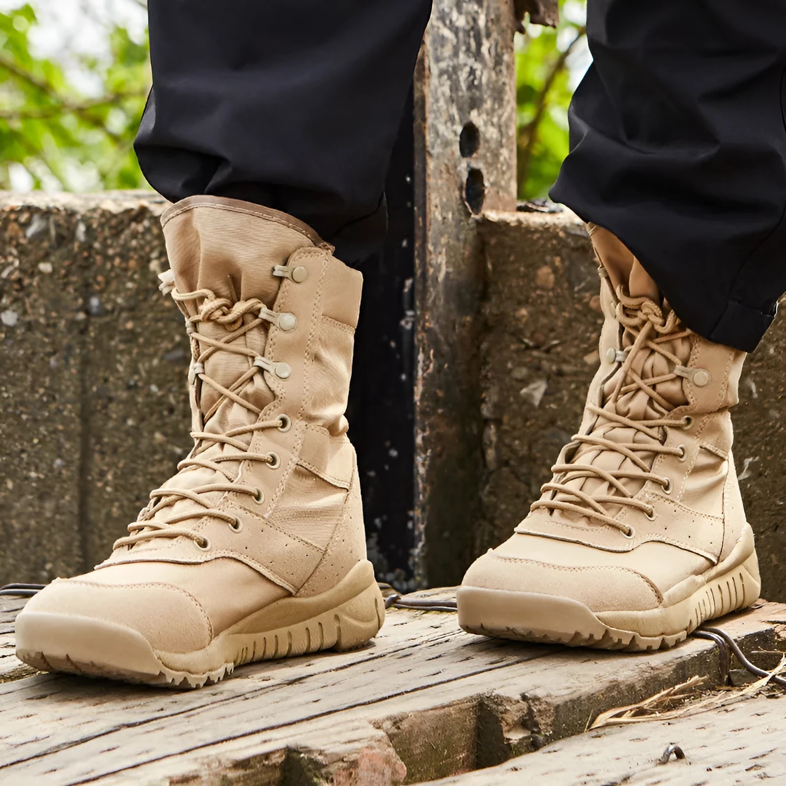 Yulong summer tactical desert combat boots in black and sand colour, shown on a rocky outdoor surface.