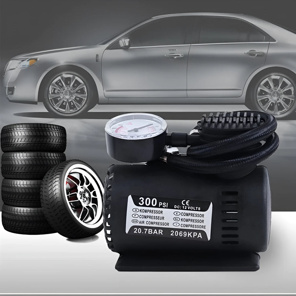 Black 12V portable mini air compressor with 300 psi gauge, 9-foot cord, and two adapter nozzles on a neutral background