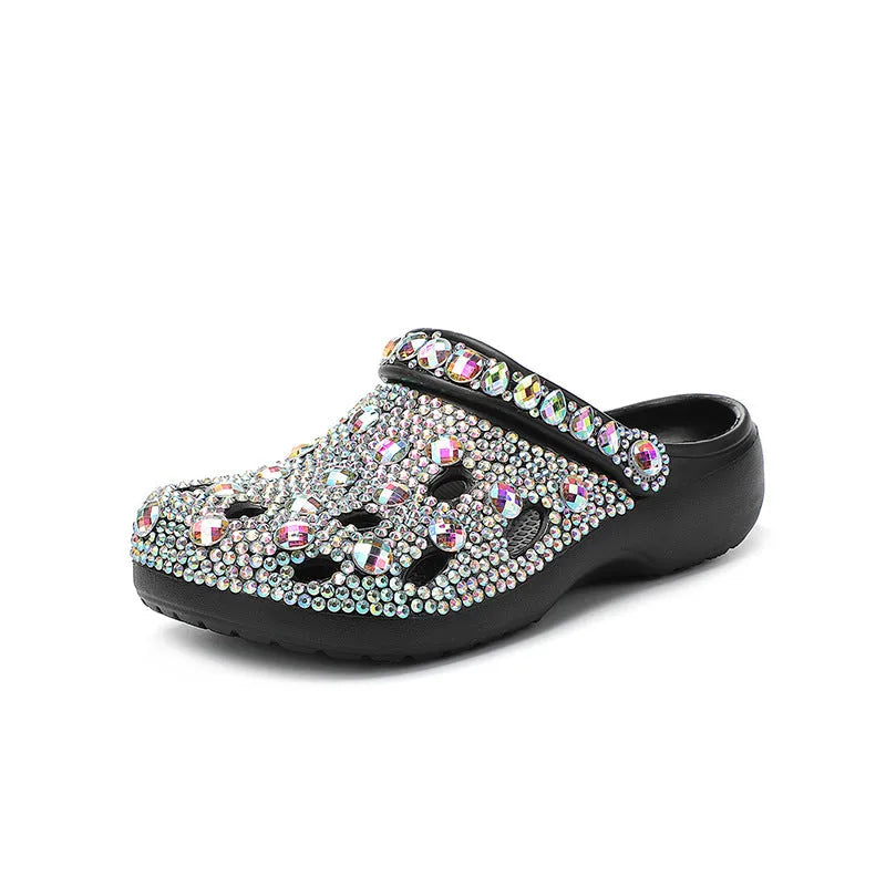 Black women's platform sandals with rhinestone decoration and a holey EVA upper.