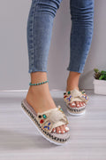 Women's beige platform sandals with bow detail, round toe and cloth upper, side view