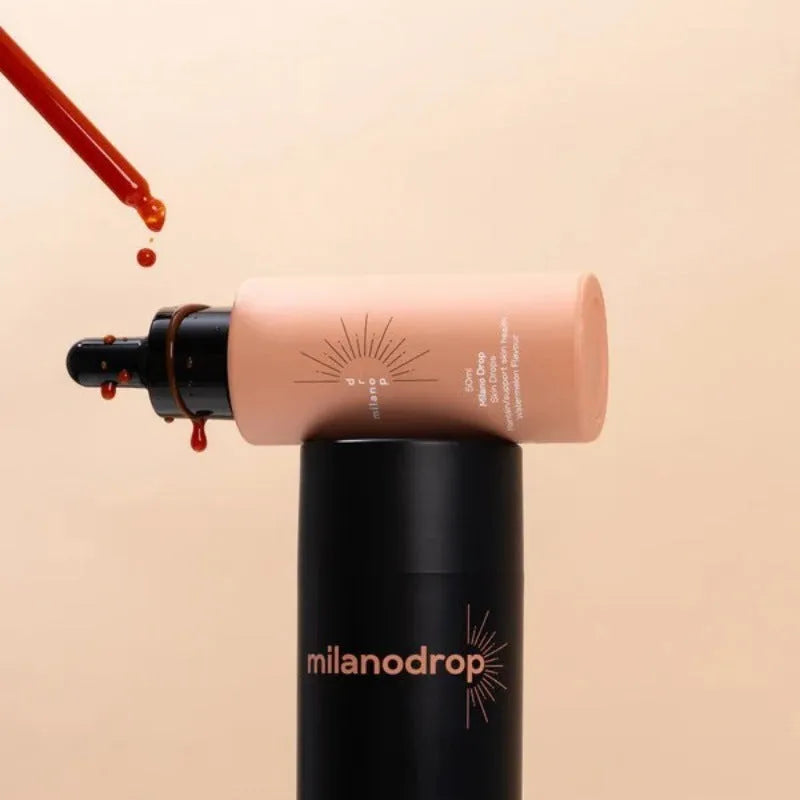 Matte black self-tanning liquid bottle and tanning flash cream tube for body care.