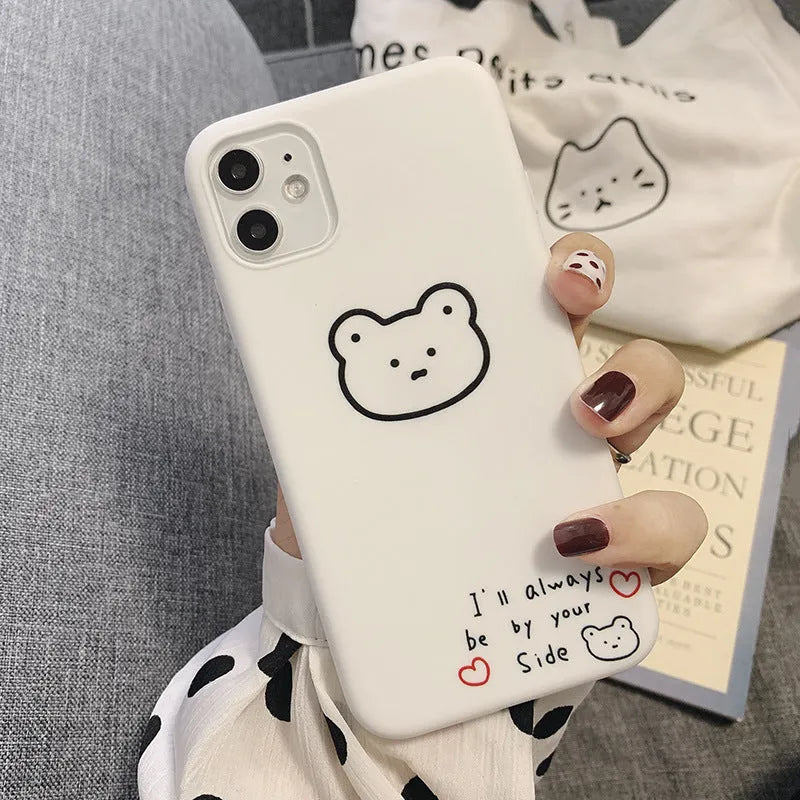 Soft silicone mobile phone case with Korean bear cartoon design for Samsung Z Flip 6 and iPhones.