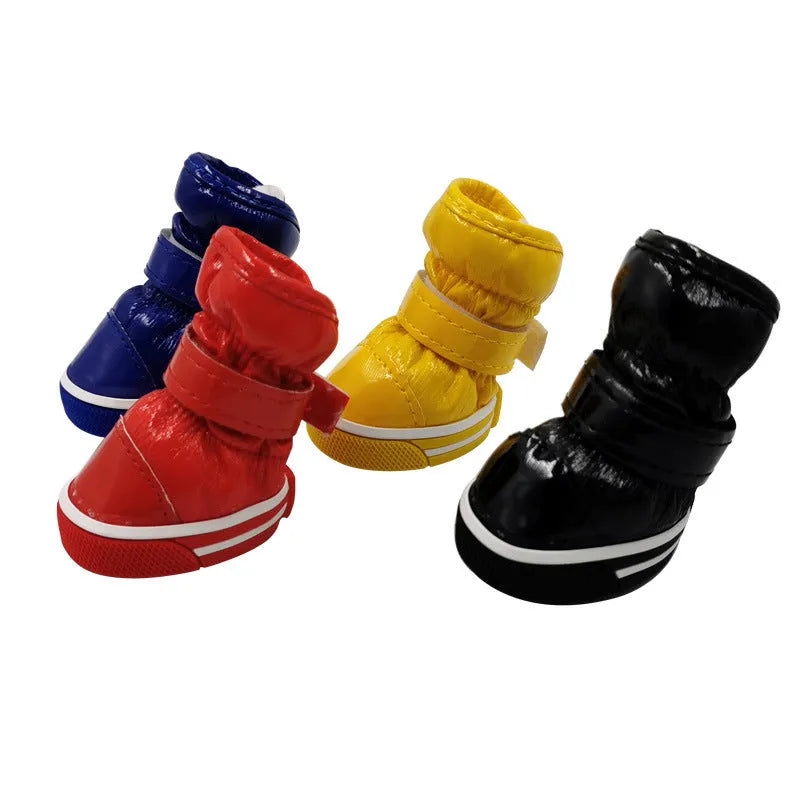 Dog cotton ski boots in four colours on a dog's paws for winter walking
