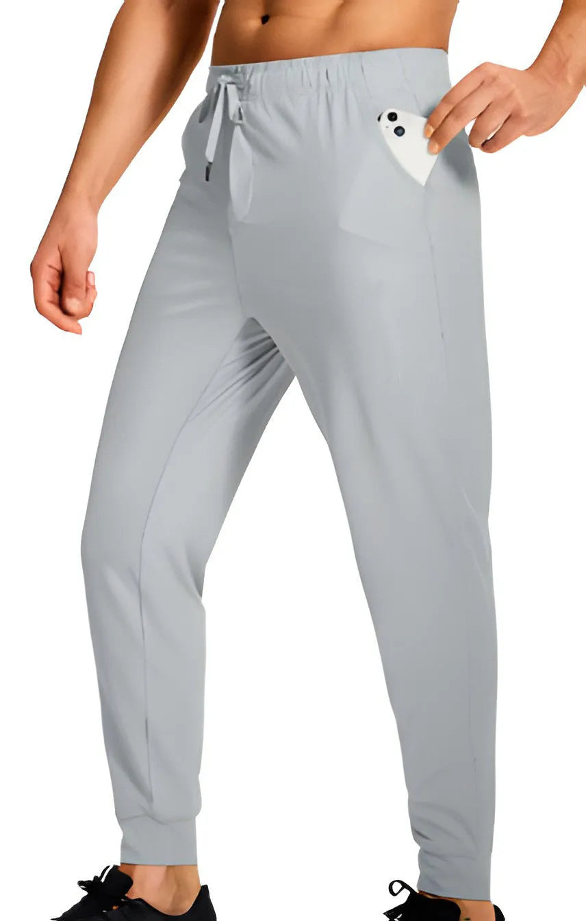 Men's loose fit casual polyester trousers in a solid colour, shown on a hanger.