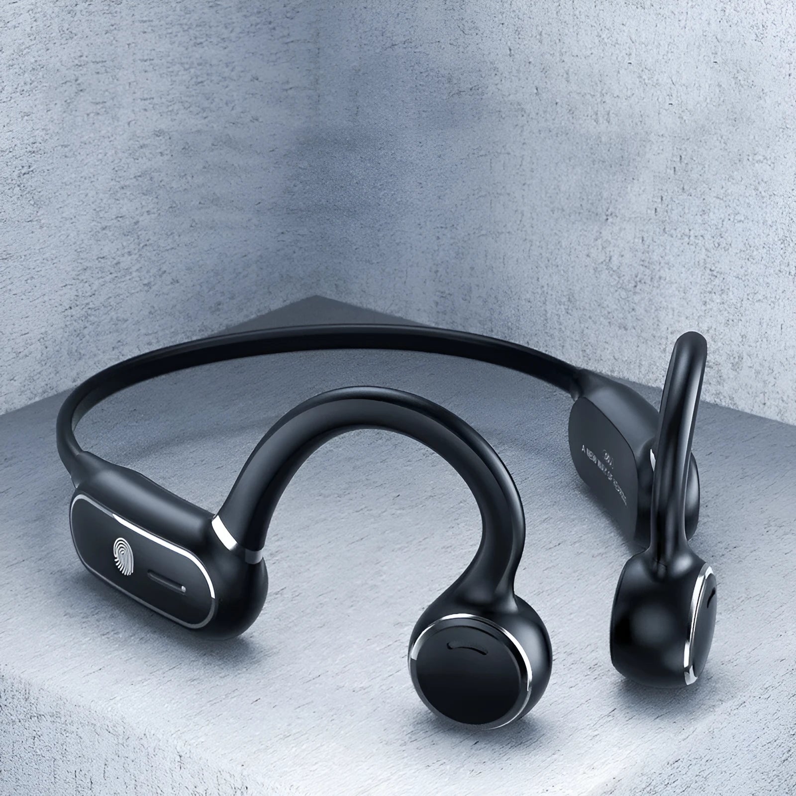 Black air conduction Bluetooth earphones with titanium wire frame showing ear-hook design
