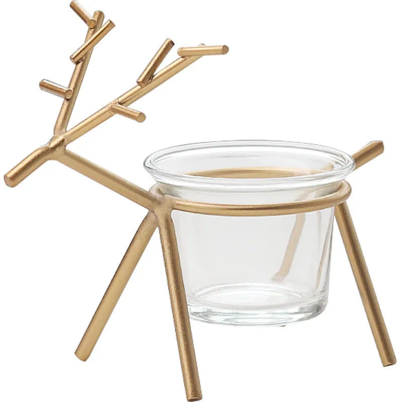 Wrought iron fawn-shaped candle holder with glass cup in gold electroplated finish