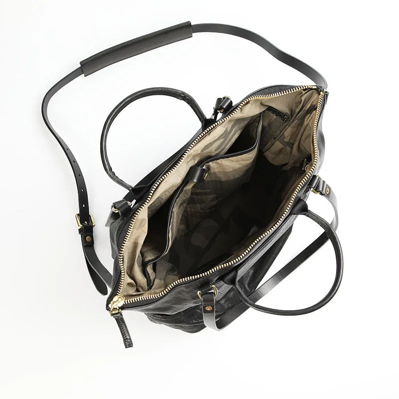Black handmade vegetable tanned cowhide tote bag with zipper closure and large capacity for travel