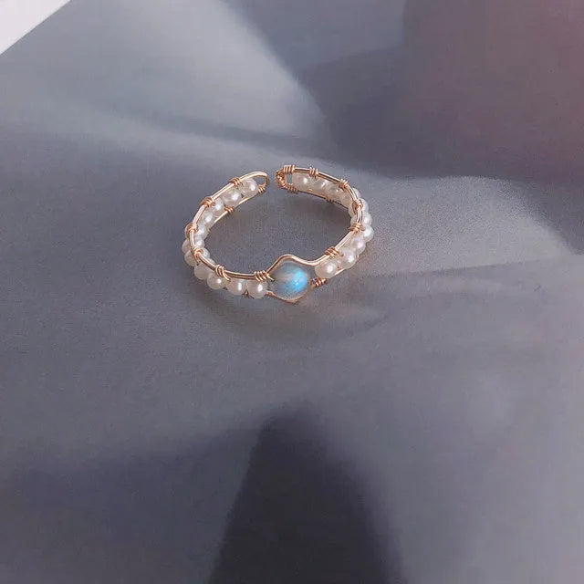 Grey Moonlight Pearl Ring with natural moonstone and blue labradorite crystal on finger, women's ring size model