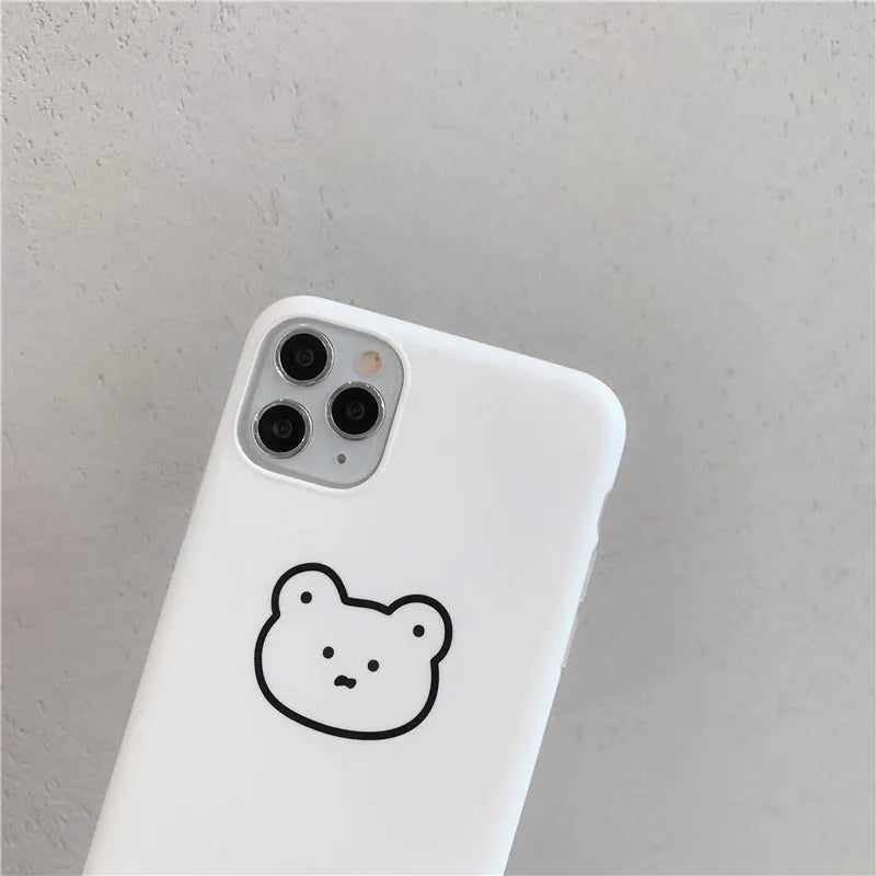 Soft silicone mobile phone case with Korean bear cartoon design for Samsung Z Flip 6 and iPhones.