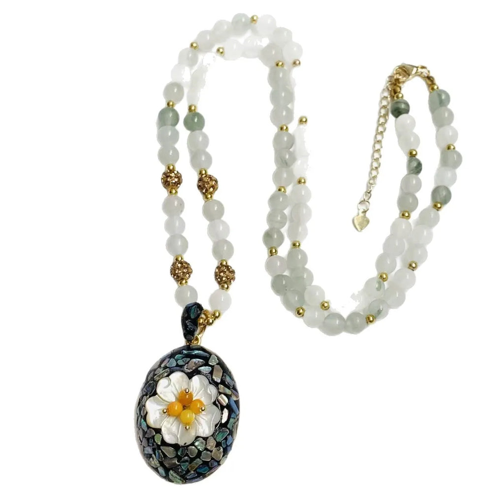 Original design mother-of-pearl shell necklace with rhinestone accents and twist chain