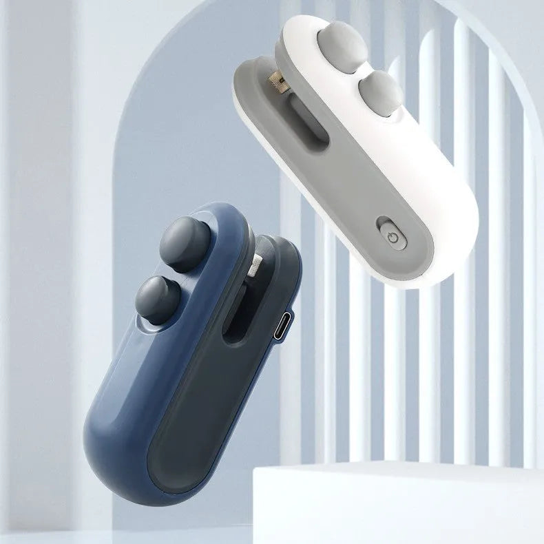 White and blue handheld USB rechargeable vacuum heat sealer with magnetic back