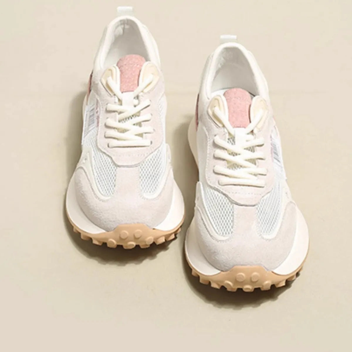 Women's grey and pink retro sneaker with low-top design and rubber sole