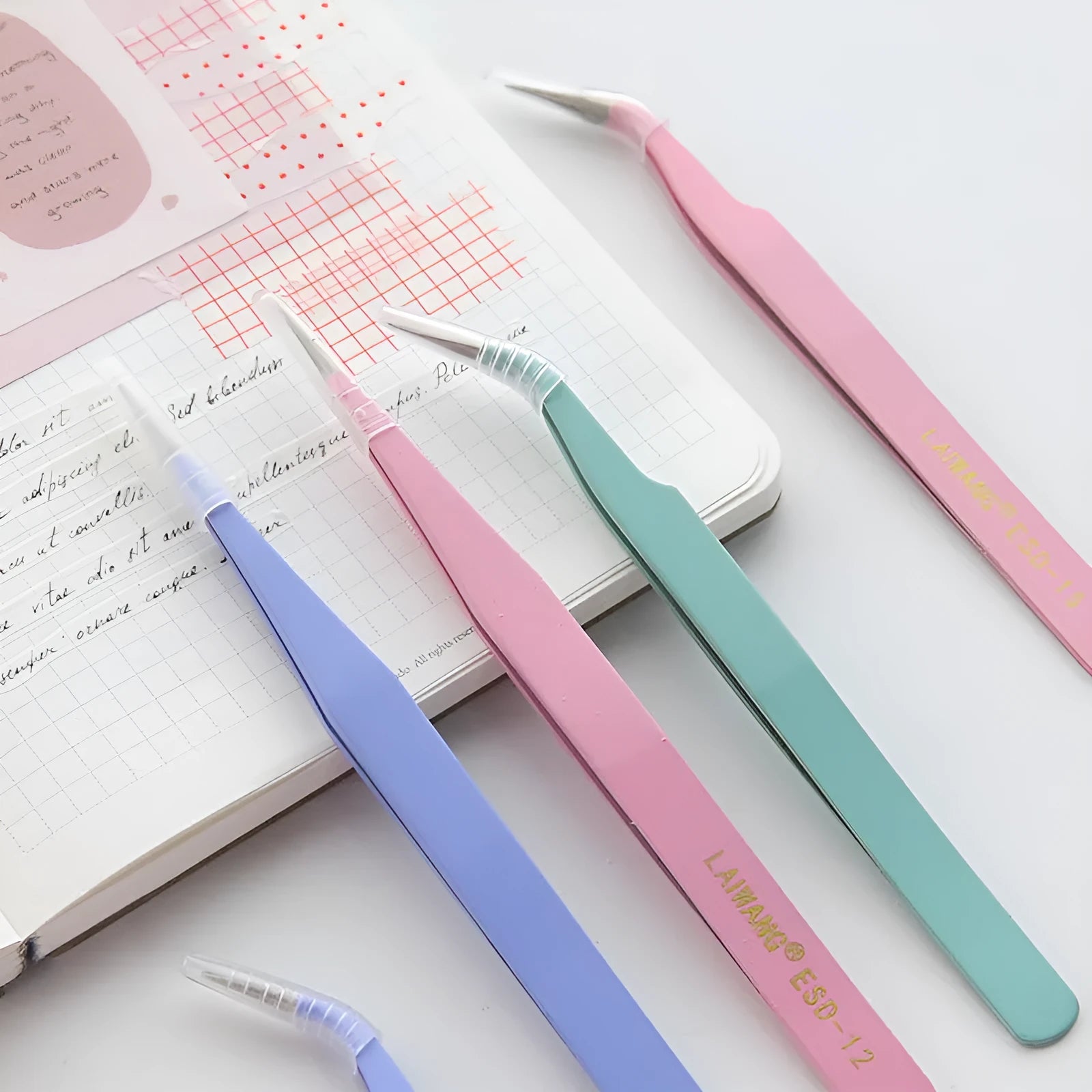 Stainless steel tweezers macaron coloured straight and elbow styles on paper card packaging