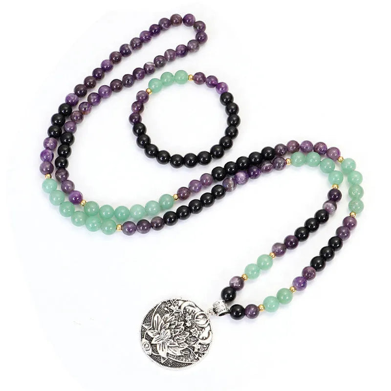 Dongling Long adjustable stone bead necklace with alloy lotus pendant and matching bracelet.
