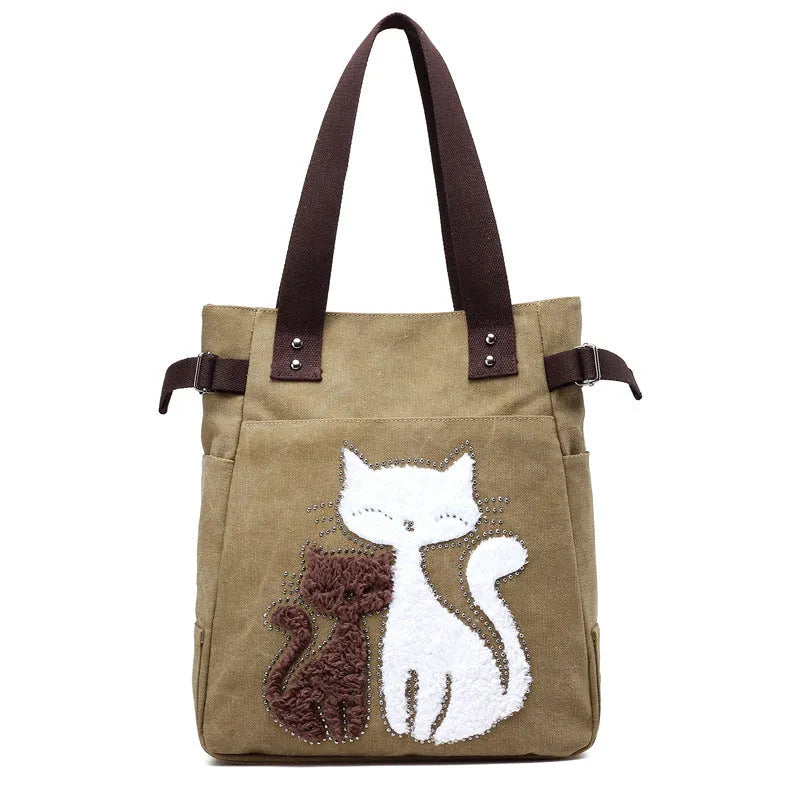 KVKY women canvas shoulder bag with cute plush cat applique in beige colour on white background