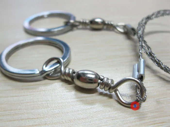 Multifunctional survival wire saw with stainless steel cutting wire and metal pull rings extended to full length