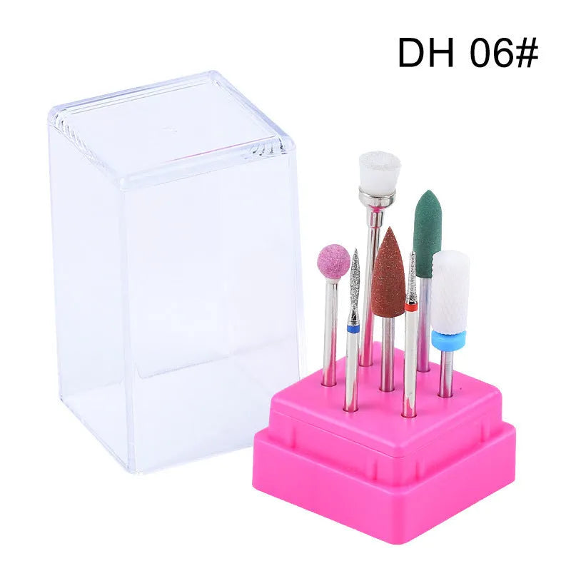 Set of seven tungsten steel nail drill bits and a brush in a clear plastic case for nail polishing