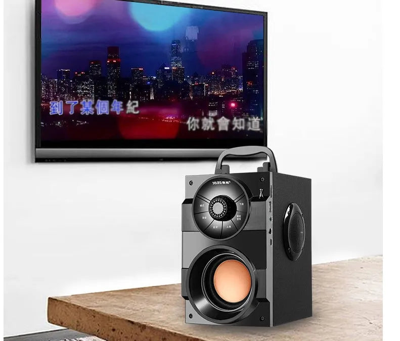 Black portable mini audio system with satellite speakers and subwoofer unit showing 3.5mm audio cable