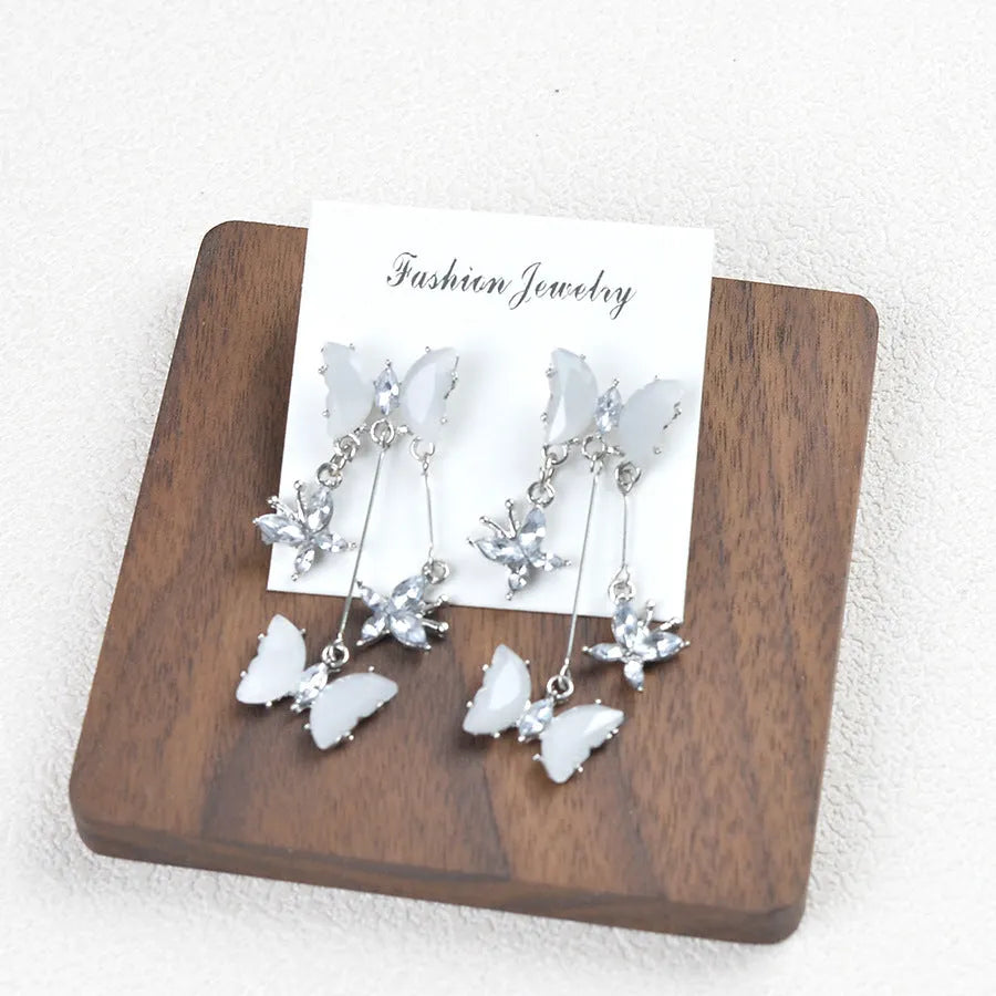 Butterfly fringe earrings in alloy and glass with electroplated finish, 1.8 x 5.3cm, light luxury style