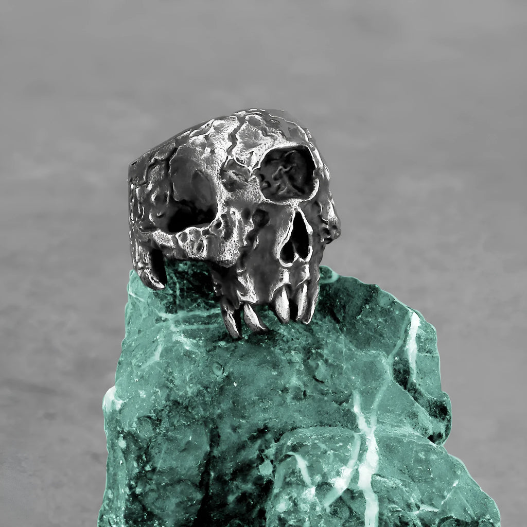 Silver alloy ring with a detailed one-eyed skull design in a retro punk style.