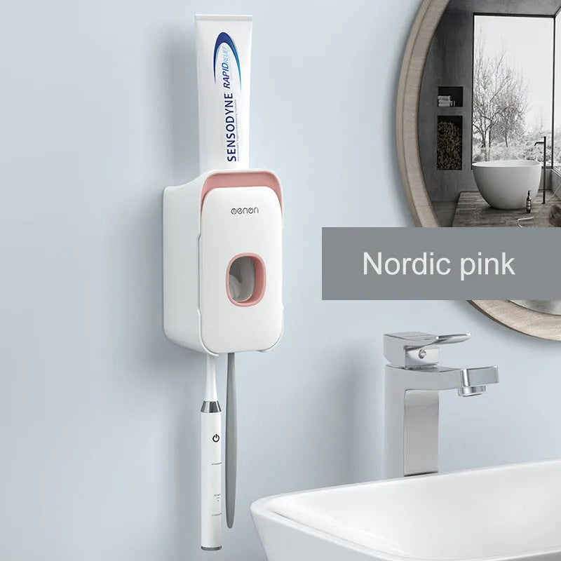Blue automatic toothpaste dispenser mounted on a bathroom wall with a transparent window showing paste inside.